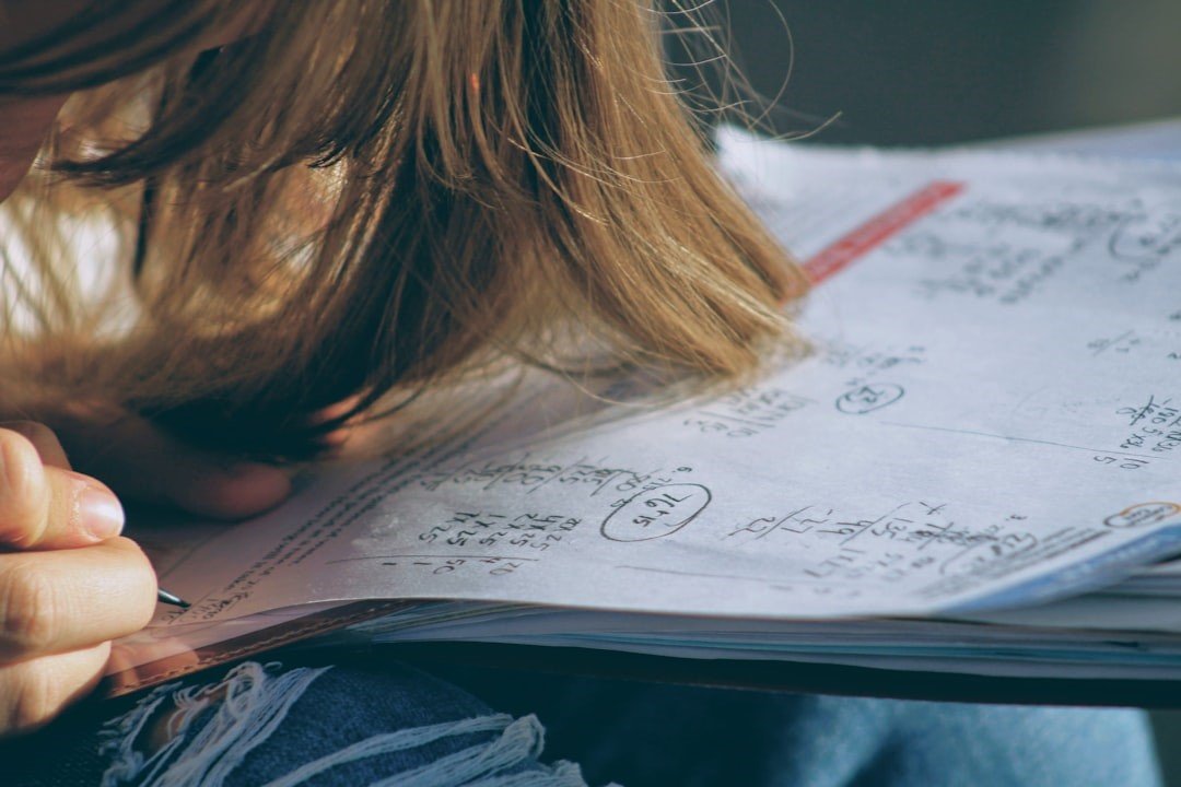 A Teen doing math test