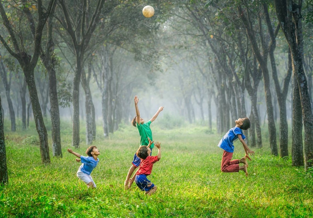 Children play with a ball