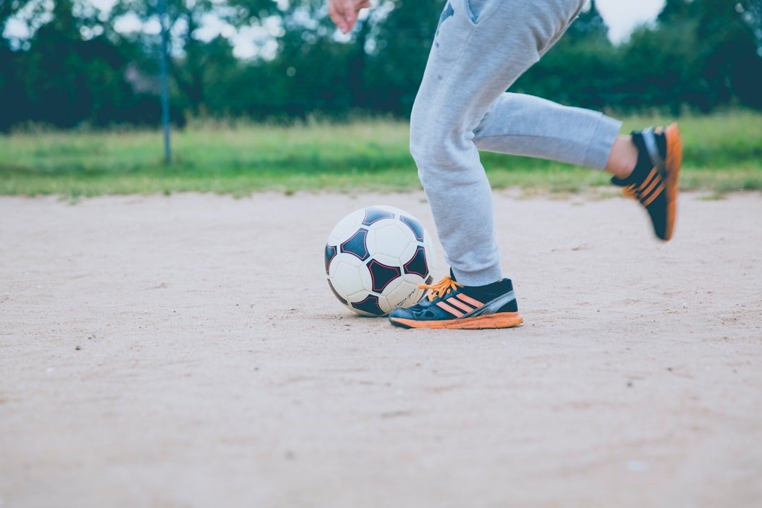 A boy is practicing Soccer