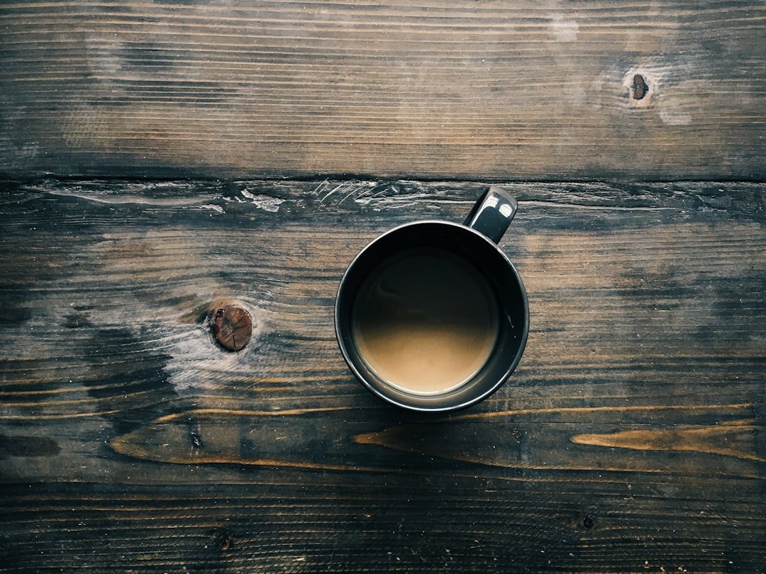 A cup of coffee on wooden table