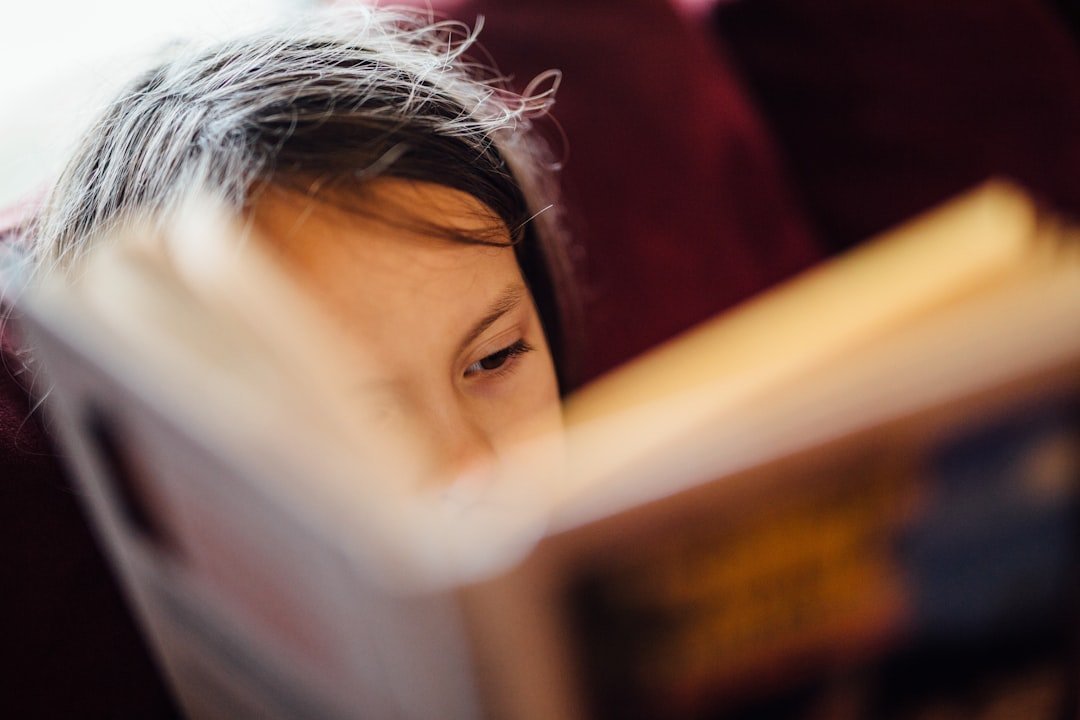 A girl reading a book quietly