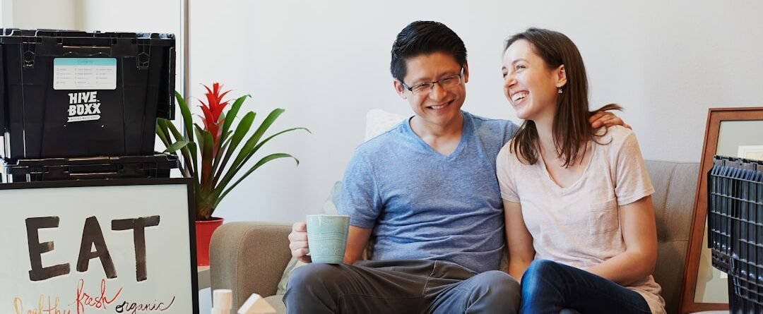 A married couple in a children's room