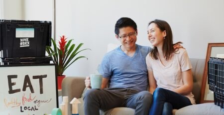 A married couple in a children's room