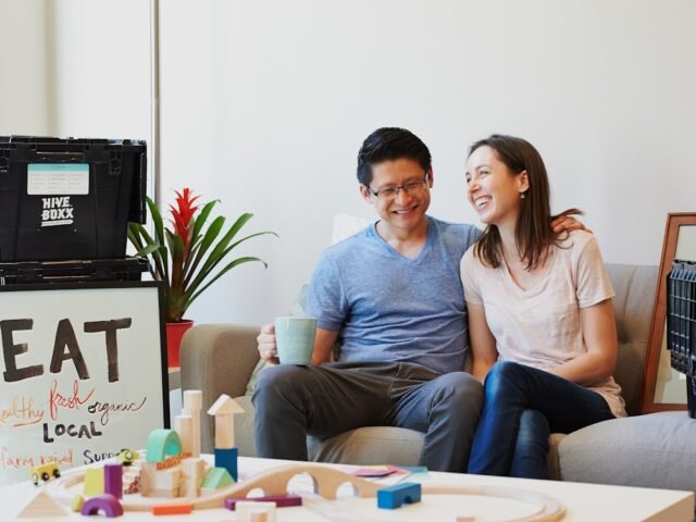 A married couple in a children's room