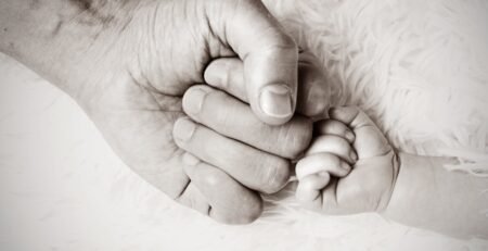 child and father fist touch